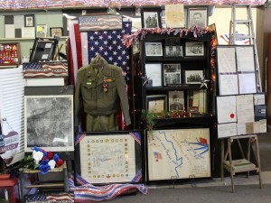 Display of Delmore Mitch [Aleta's father] WWII items, including maps. (2015 photo by Karen)