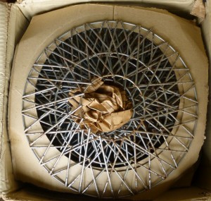 Box of wire wheel covers.