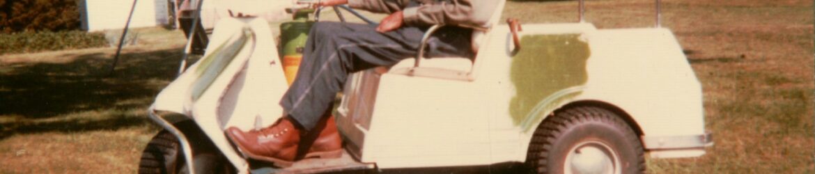 Cornelius Schumm in his golf cart, 1984.